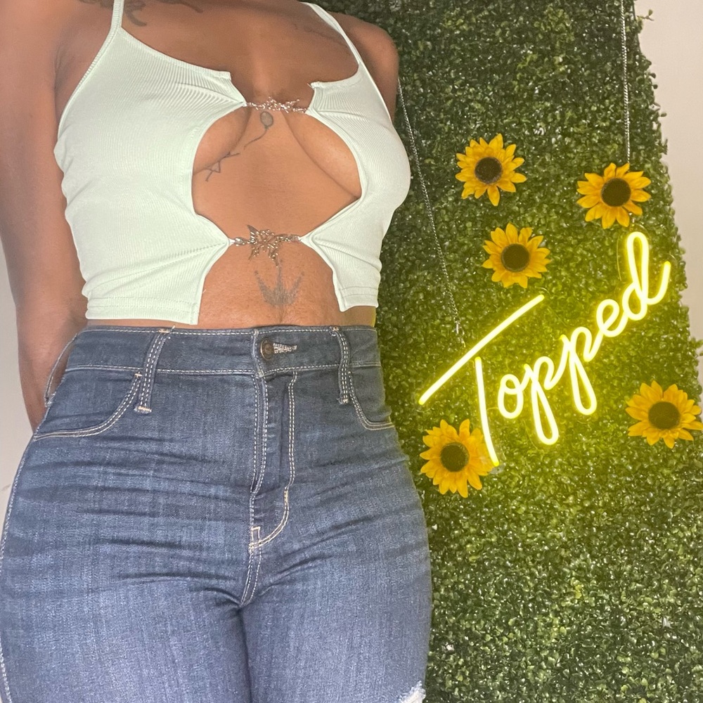 Butterfly pin tank top in various colors.